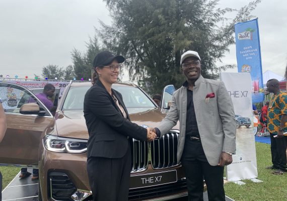 Cosmas Maduka with the representative of German Consulate at the unveiling of BMW X7