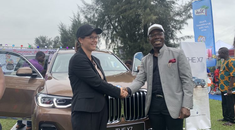Cosmas Maduka with the representative of German Consulate at the unveiling of BMW X7